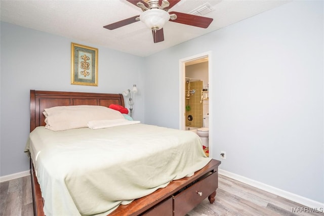 5217 W Shades Valley Dr, Montgomery, AL 36108 - bedroom featuring ensuite bath, light wood-style flooring, visible vents, and baseboards