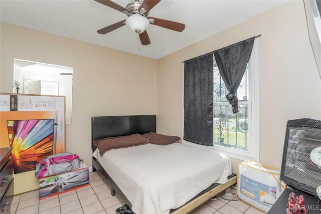 5217 W Shades Valley Dr, Montgomery, AL 36108 - tiled bedroom with a textured ceiling and a ceiling fan