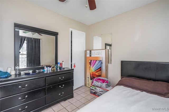 5217 W Shades Valley Dr, Montgomery, AL 36108 - bedroom featuring light tile patterned floors and a ceiling fan
