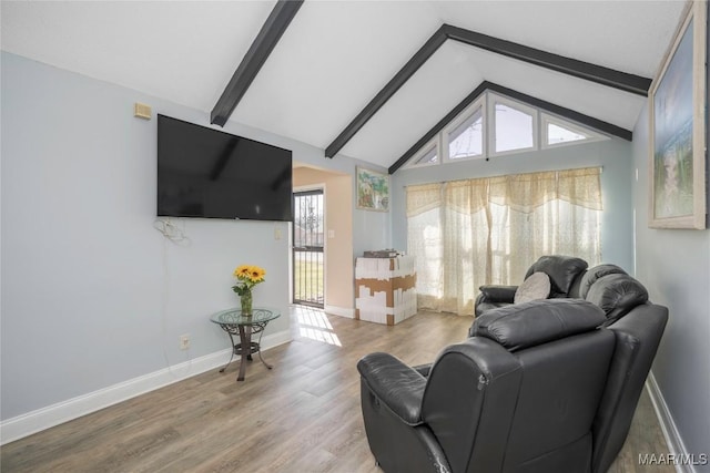 5217 W Shades Valley Dr, Montgomery, AL 36108 - living room featuring vaulted ceiling with beams, baseboards, and wood finished floors