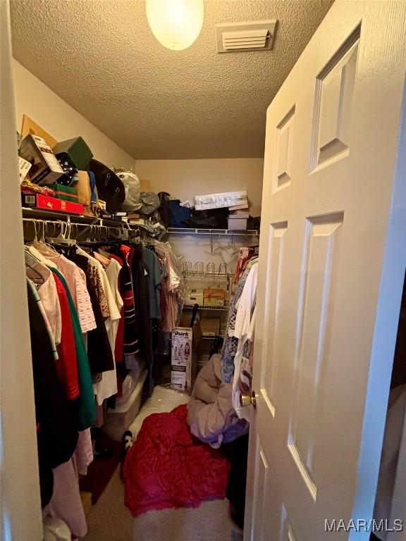 walk in closet featuring visible vents