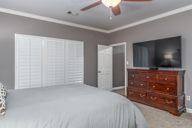 bedroom with a ceiling fan, visible vents, ornamental molding, and carpet flooring