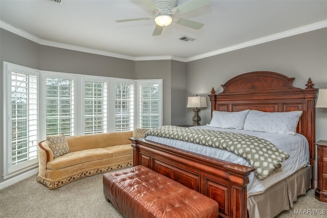 bedroom with light carpet, a ceiling fan, visible vents, and crown molding