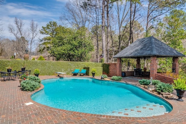 view of pool with a fenced in pool, a patio, a gazebo, a fenced backyard, and a diving board