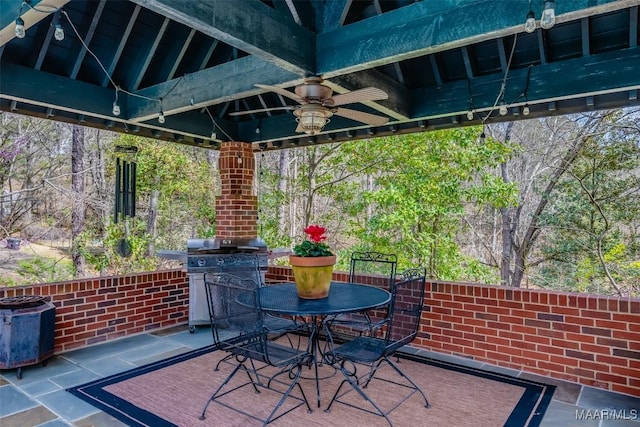 view of patio / terrace featuring ceiling fan, a gazebo, outdoor dining space, and area for grilling