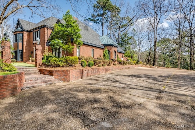 view of home's exterior featuring brick siding