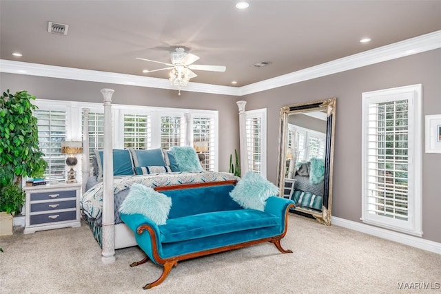 carpeted bedroom with ornamental molding, visible vents, baseboards, and a ceiling fan