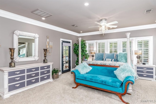 carpeted bedroom featuring a ceiling fan, visible vents, and crown molding