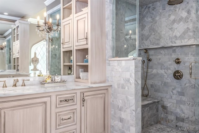 full bathroom with ornamental molding, a tile shower, and vanity