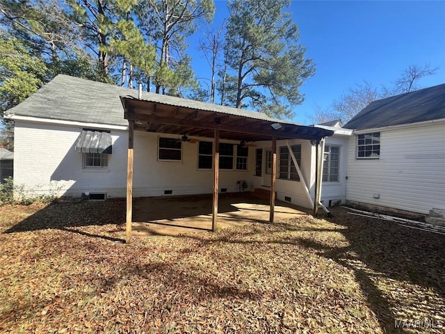 rear view of house with entry steps and crawl space