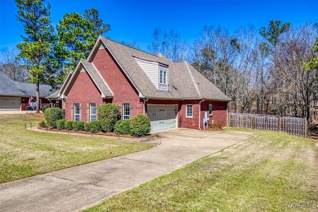 view of front of house featuring brick siding, fence, roof with shingles, a front yard, and driveway