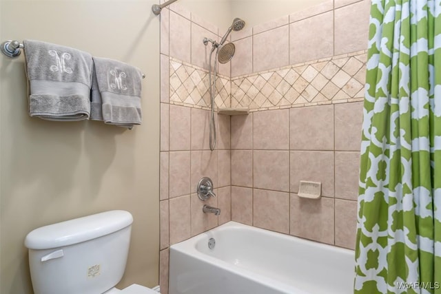 bathroom with shower / bath combination with curtain and toilet