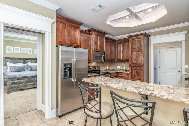 kitchen featuring visible vents, ornamental molding, stainless steel appliances, light tile patterned floors, and decorative backsplash