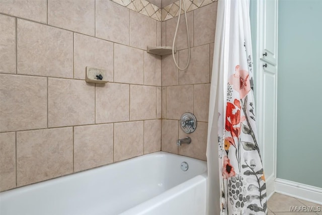 full bath with tile patterned floors, shower / tub combo, and baseboards