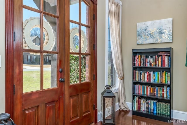 interior space featuring baseboards