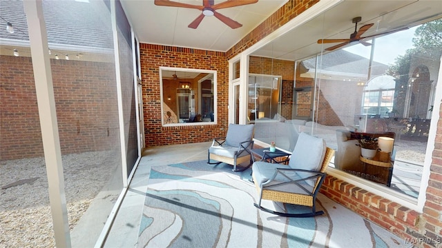 sunroom / solarium with a ceiling fan