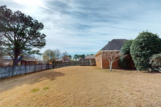 view of yard with a fenced backyard