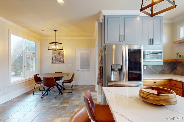 kitchen with light stone countertops, stainless steel fridge with ice dispenser, decorative backsplash, pendant lighting, and crown molding