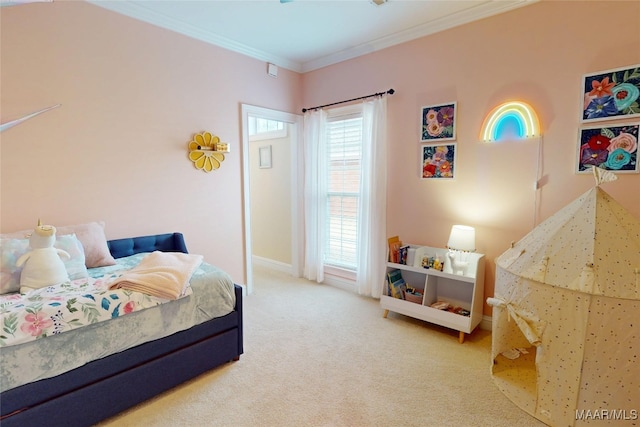 bedroom featuring carpet flooring, crown molding, and baseboards