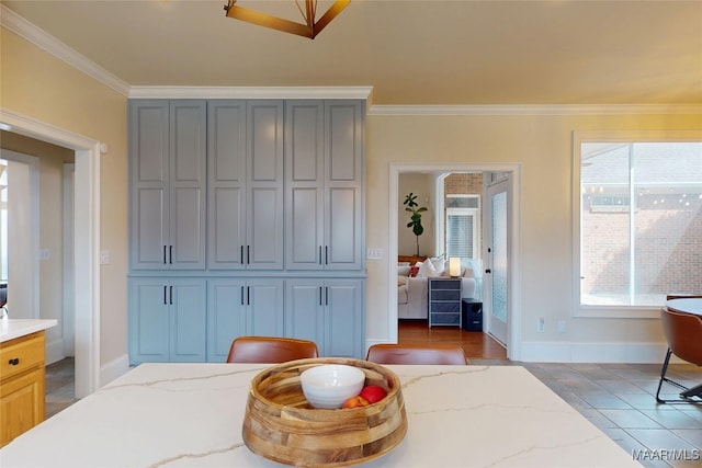 bedroom featuring baseboards and crown molding