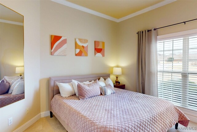 carpeted bedroom with baseboards and ornamental molding