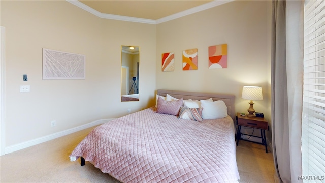 bedroom with crown molding, baseboards, and carpet floors