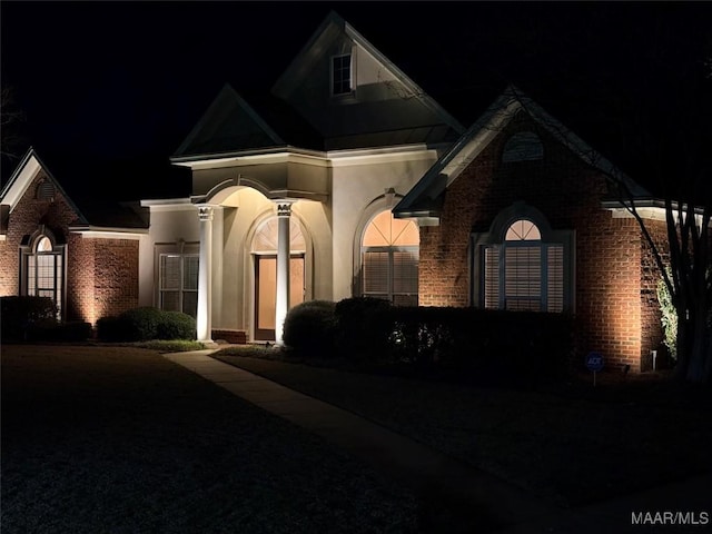 view of front of home featuring brick siding