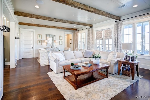 living room with visible vents, beam ceiling, and dark wood-style flooring