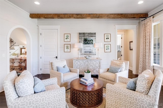 living area with beam ceiling, recessed lighting, and wood finished floors