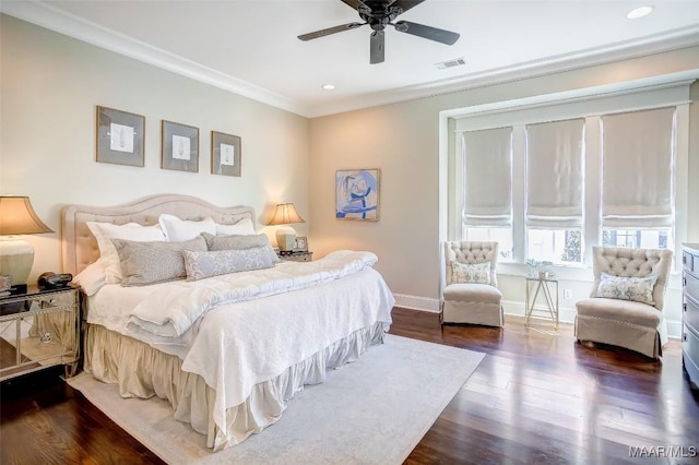 bedroom featuring wood finished floors, baseboards, visible vents, recessed lighting, and ornamental molding