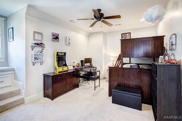 bedroom with light carpet, visible vents, and baseboards