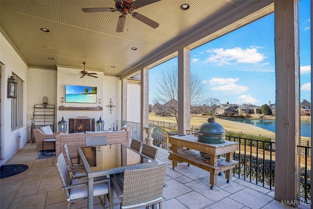 view of patio featuring ceiling fan and outdoor dining space