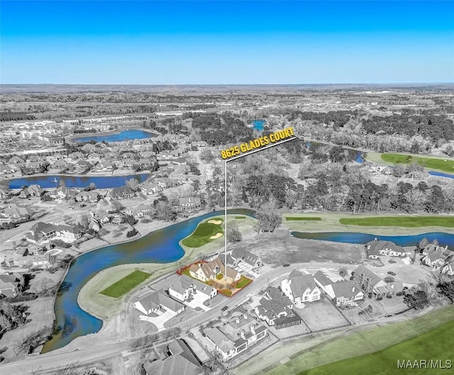 bird's eye view with a water view and golf course view