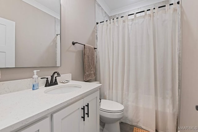 bathroom with vanity, curtained shower, and toilet