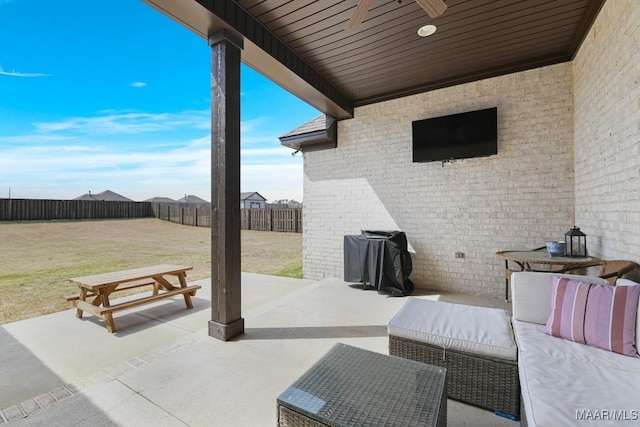 view of patio / terrace featuring a grill, outdoor lounge area, and a fenced backyard