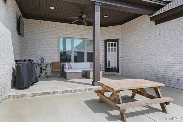 view of patio with ceiling fan, outdoor dining area, and an outdoor hangout area