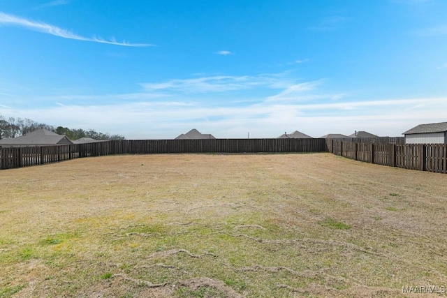 view of yard with a fenced backyard