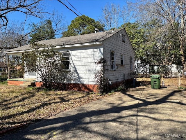 view of property exterior featuring fence