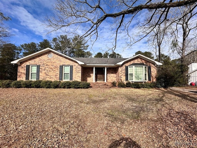 ranch-style house with brick siding