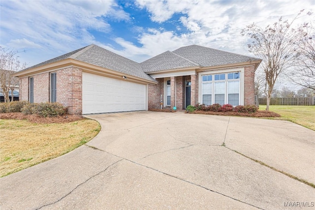 view of front facade with brick siding, driveway, an attached garage, and fence