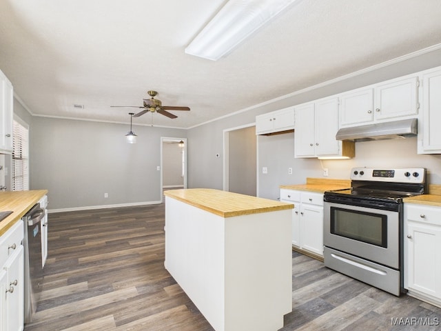 kitchen with under cabinet range hood, stainless steel appliances, wood counters, and ornamental molding