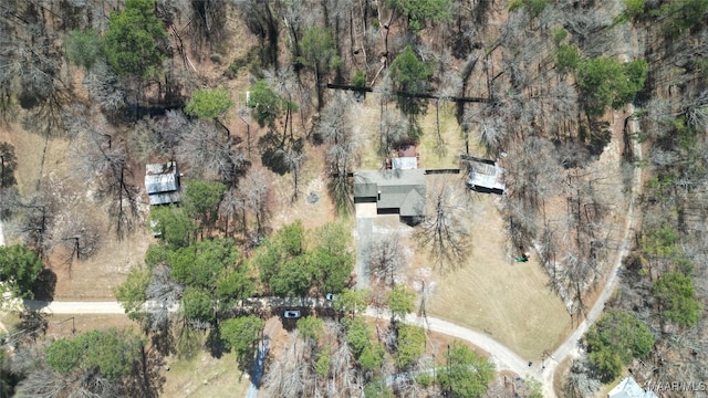 bird's eye view featuring a wooded view