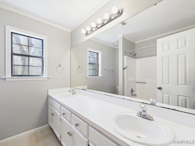 full bath featuring toilet, a healthy amount of sunlight, and a sink