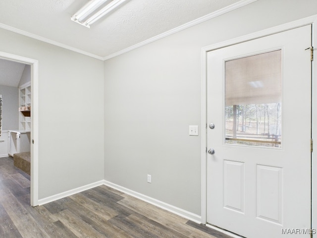 interior space with crown molding, wood finished floors, baseboards, and a textured ceiling