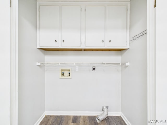 laundry area featuring electric dryer hookup, dark wood finished floors, cabinet space, baseboards, and hookup for a washing machine