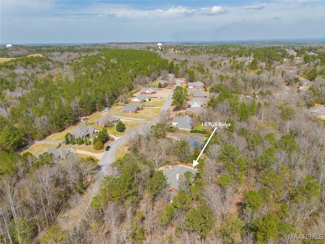 bird's eye view featuring a view of trees