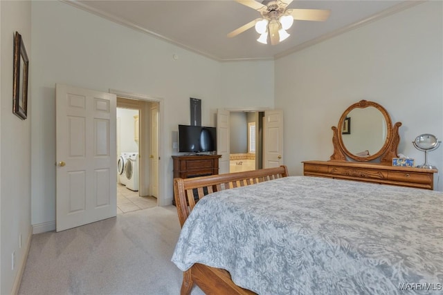 bedroom with light carpet, ornamental molding, washing machine and dryer, baseboards, and ceiling fan