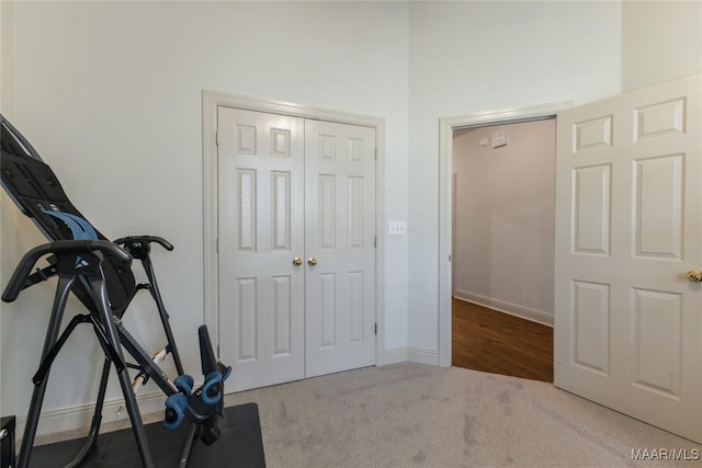 exercise area with carpet and baseboards