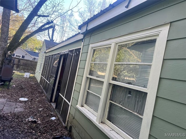 view of property exterior featuring fence