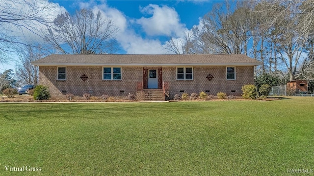 ranch-style home with entry steps, a front lawn, brick siding, and crawl space